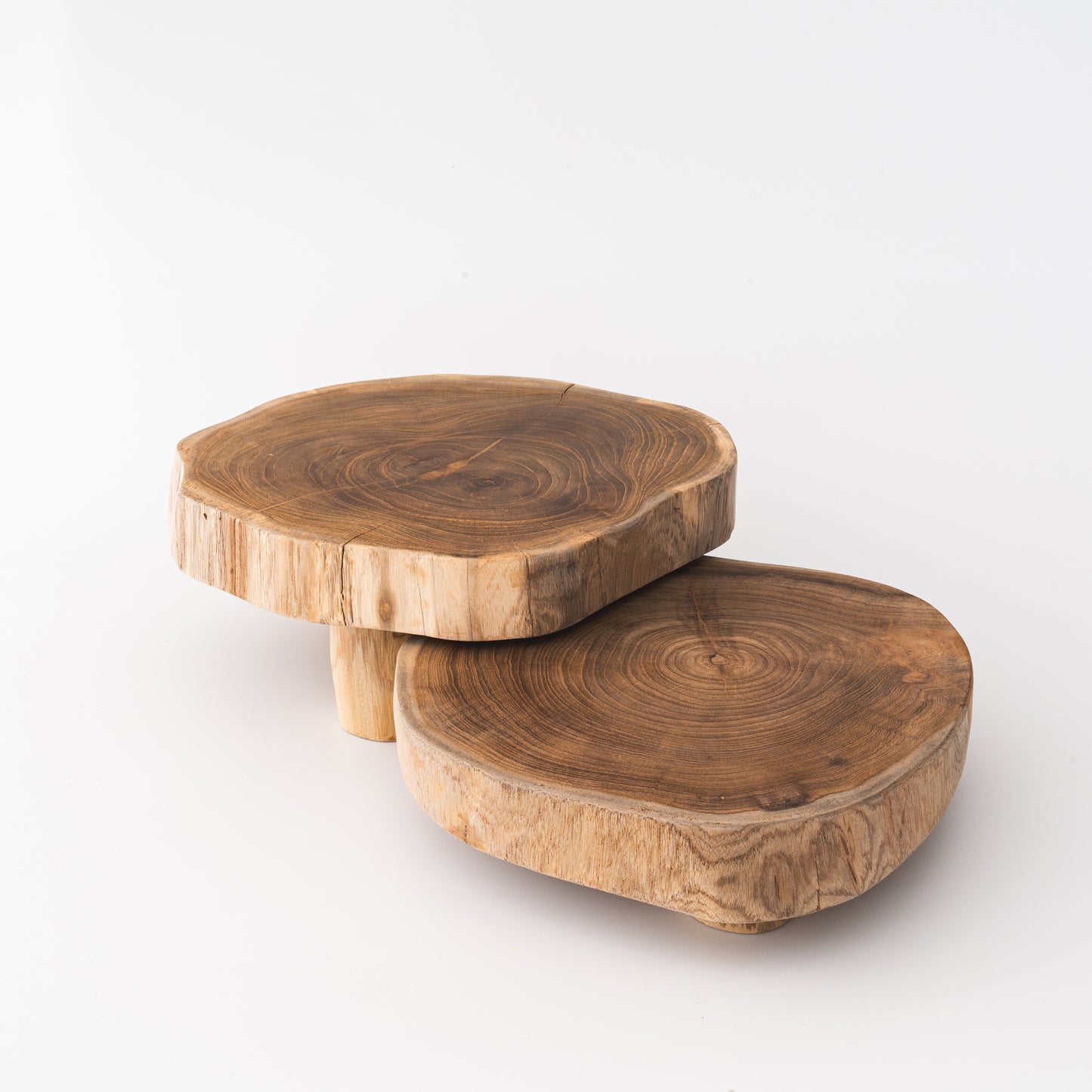 Two teak risers on white background