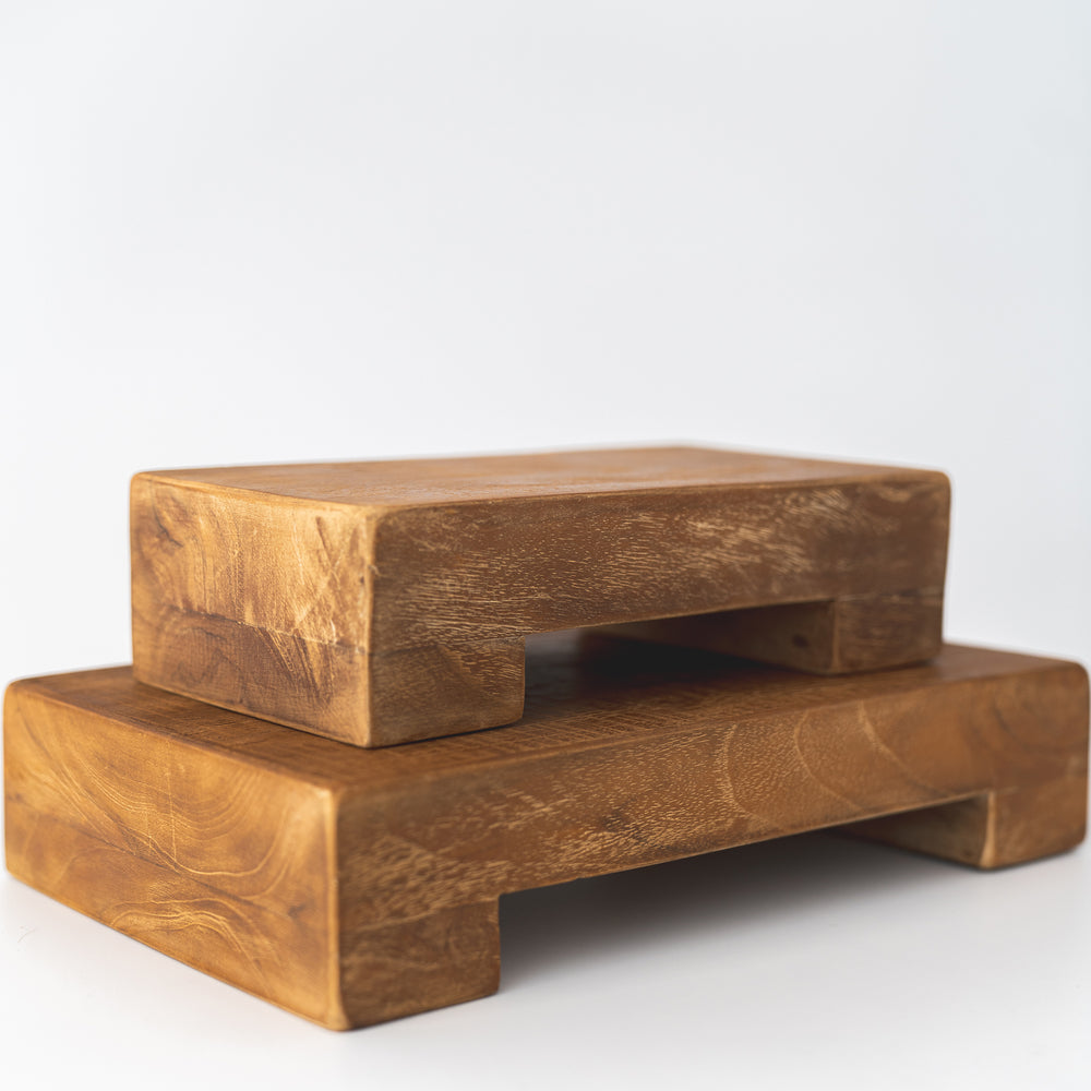 two teak trays stacked on each other 